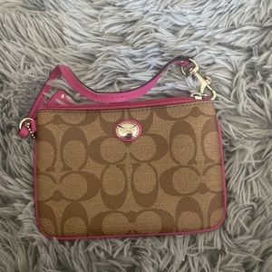 Brown and pink coach wristlet